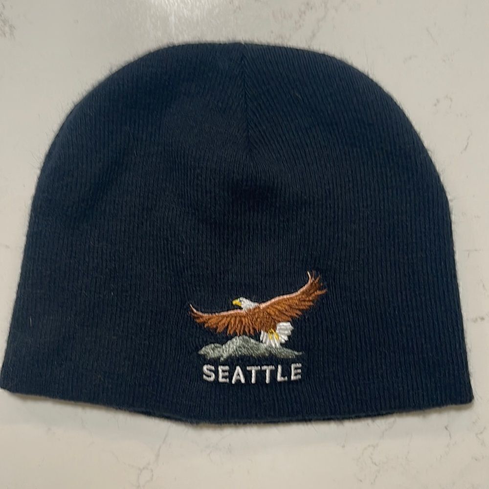 Seattle black knit beanie hat.  Embroidered eagle with mountain.  One size.